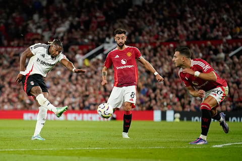 Manchester United Vs Fulham: Fulham's Adama Traore, left, gets in a shot watched by United's Bruno Fernandes and Diogo Dalot